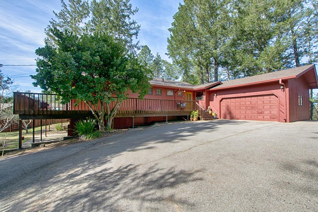79 Pine Avenue Mount Hermon, CA 95041 - Photo 20 of 32 a front view of a house with garage and parking