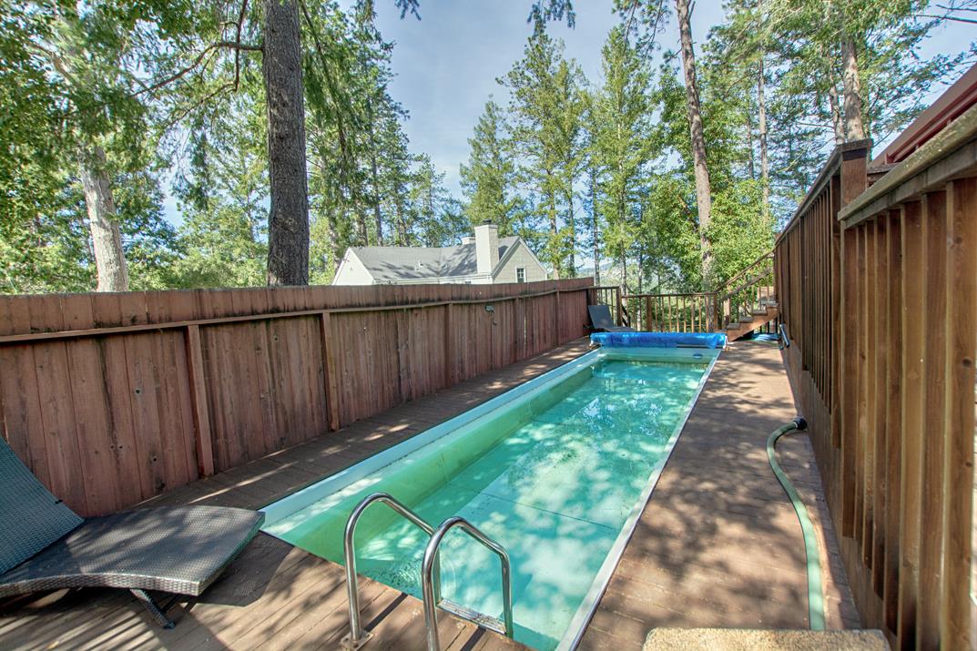 79 Pine Avenue Mount Hermon, CA 95041 - Photo 27 of 32 a backyard with wooden fence and large trees