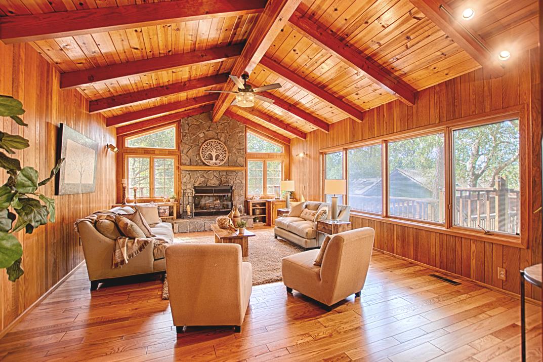 79 Pine Avenue Mount Hermon, CA 95041 - Photo 6 of 32 a living room with furniture a large window and wooden floor