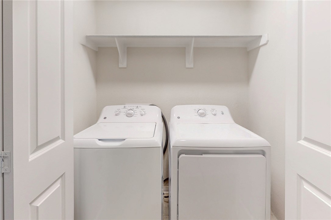 3719 Mckenzie Street Bryan, TX 77803 - Photo 11 of 20 a utility room with dryer and washer