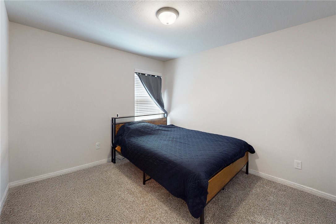 3719 Mckenzie Street Bryan, TX 77803 - Photo 12 of 20 a bedroom with a bed and a window