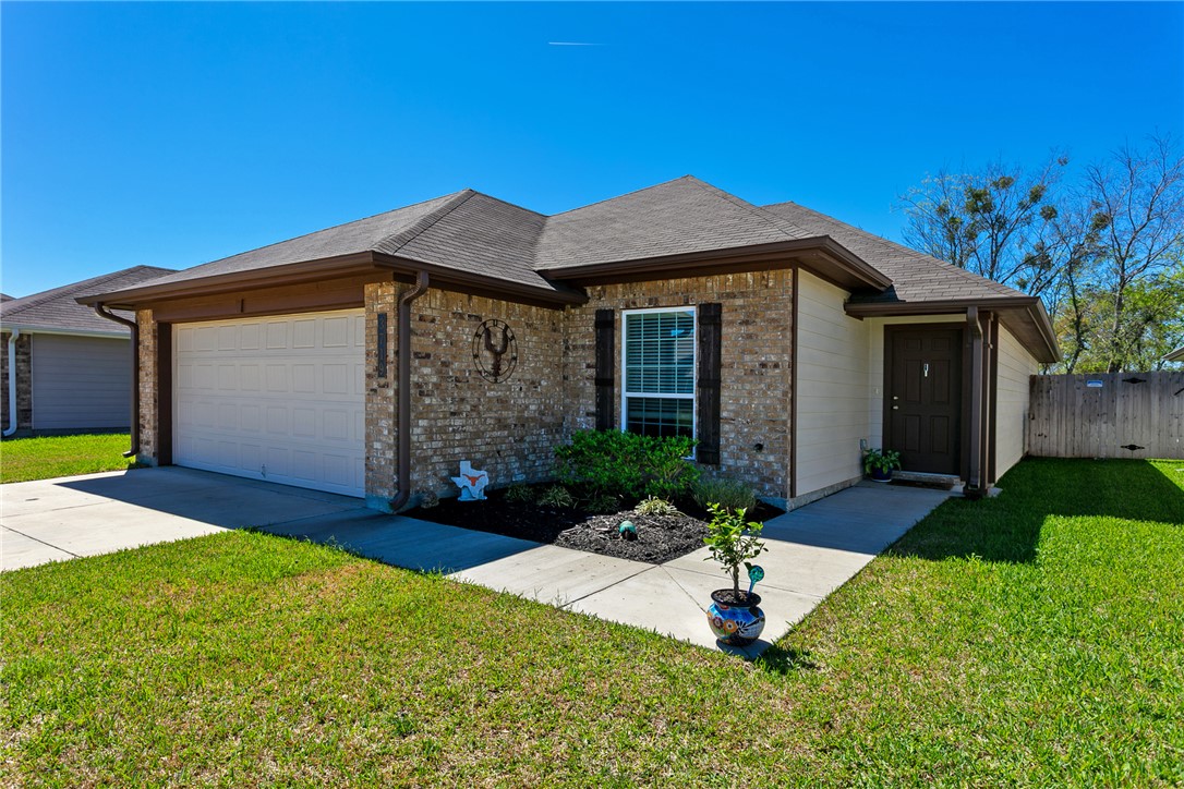 3719 Mckenzie Street Bryan, TX 77803 - Photo 2 of 20 a front view of a house with a yard