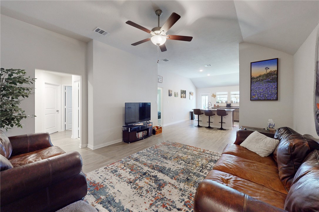 3719 Mckenzie Street Bryan, TX 77803 - Photo 3 of 20 a living room with furniture and a flat screen tv
