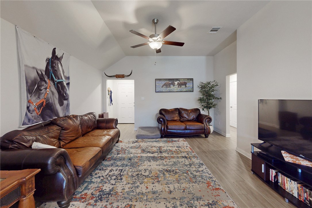 3719 Mckenzie Street Bryan, TX 77803 - Photo 5 of 20 a living room with furniture and a flat screen tv