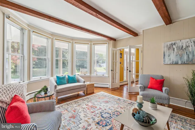 a living room with furniture and a rug