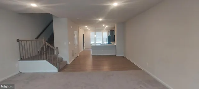 a bathroom with a sink a large mirror and a bathtub