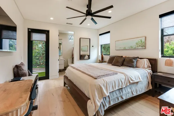 a bathroom with double vanity and a shower