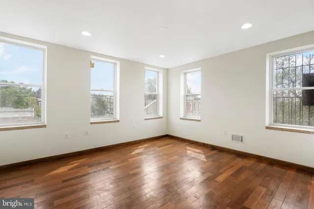 a white refrigerator freezer and a stove sitting inside of a kitchen