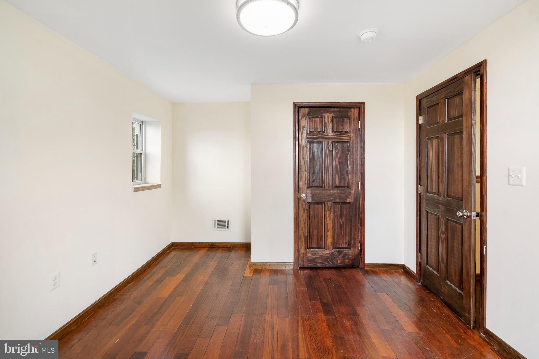 2400 Druid Hill Avenue Baltimore, MD 21217 - Photo 17 of 27 an empty room with wooden floor and closet
