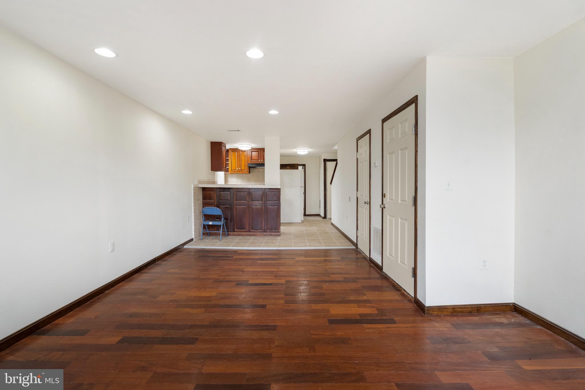 2400 Druid Hill Avenue Baltimore, MD 21217 - Photo 7 of 27 a view of a hallway with wooden floor and staircase