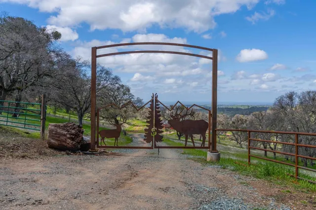 a view of a field with sitting area