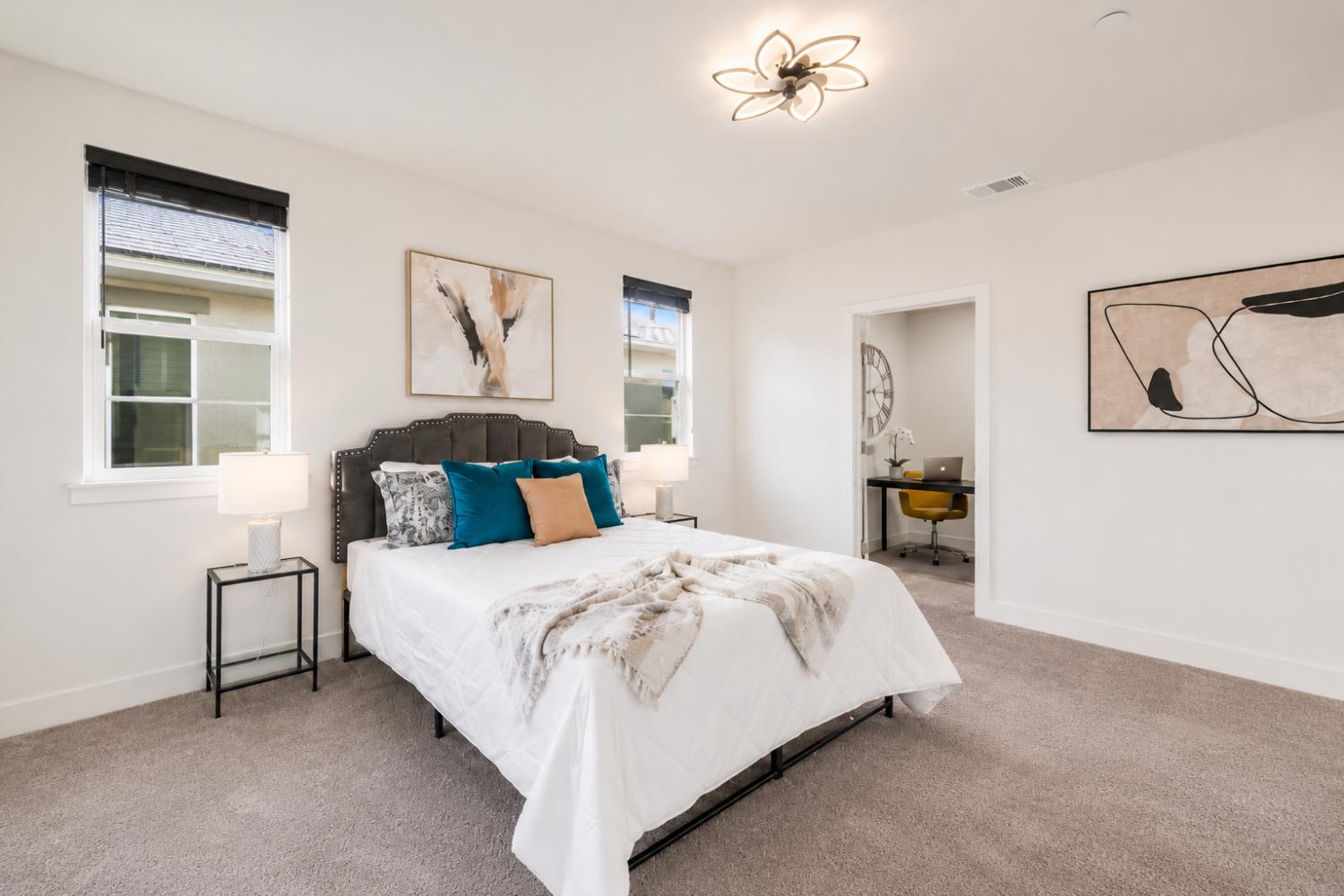 1837 South La Barbera Avenue Mountain House, CA 95391 - Photo 22 of 54 a bedroom with a bed and a chandelier