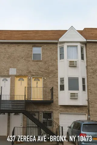 a front view of a building with glass windows
