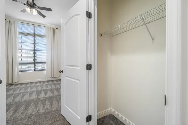 a spacious bathroom with a double vanity sink mirror and bathtub