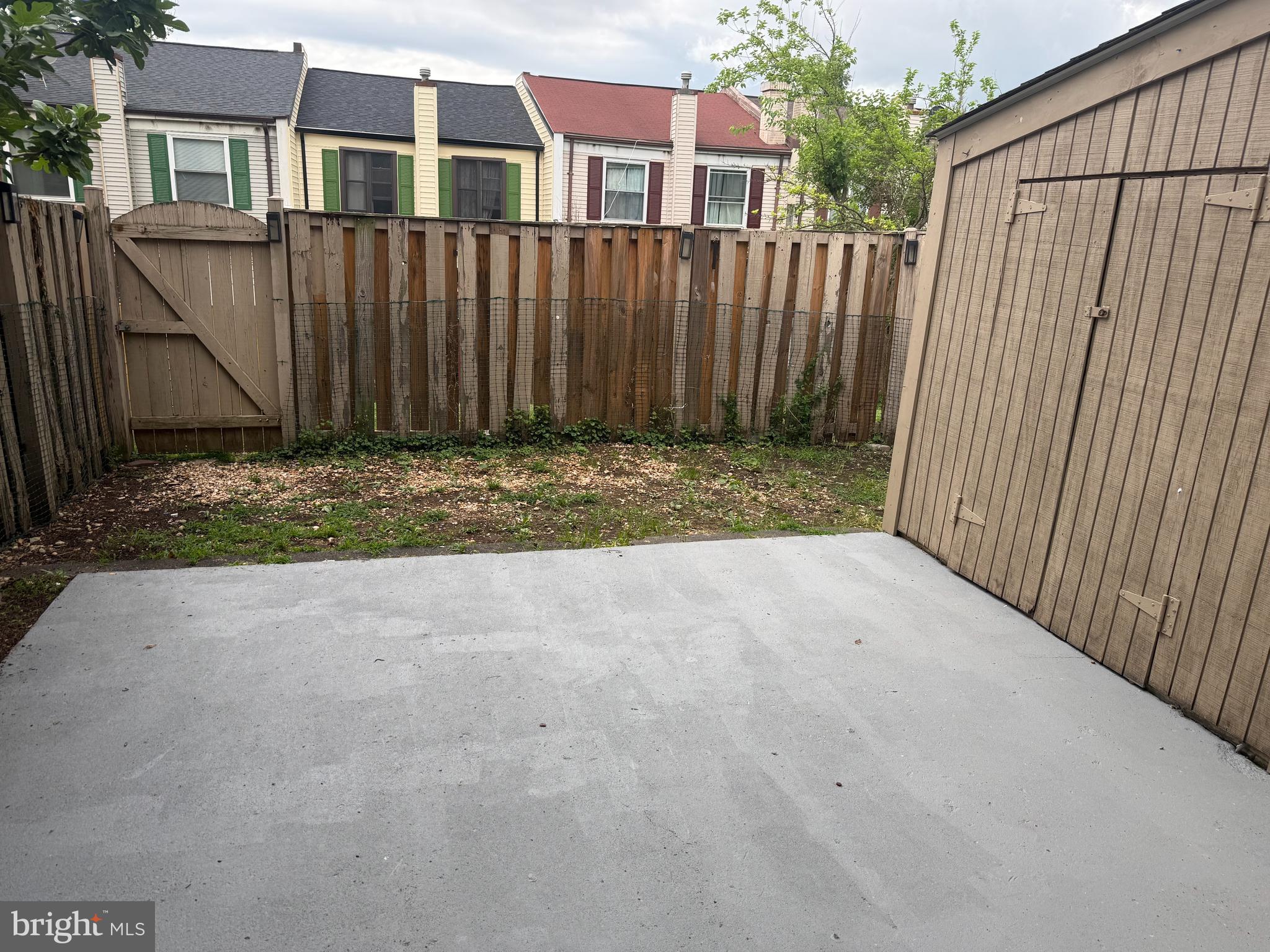 1287 Springtide Place Herndon, VA 20170 - Photo 20 of 23 a view of a house with wooden fence