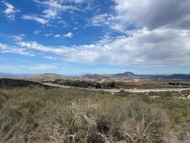 a view of a lake with furniture