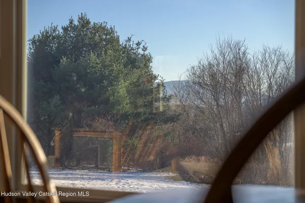 a view of a dining room with furniture wooden floor and chandelier