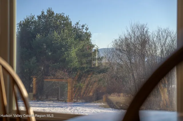 a view of a dining room with furniture wooden floor and chandelier