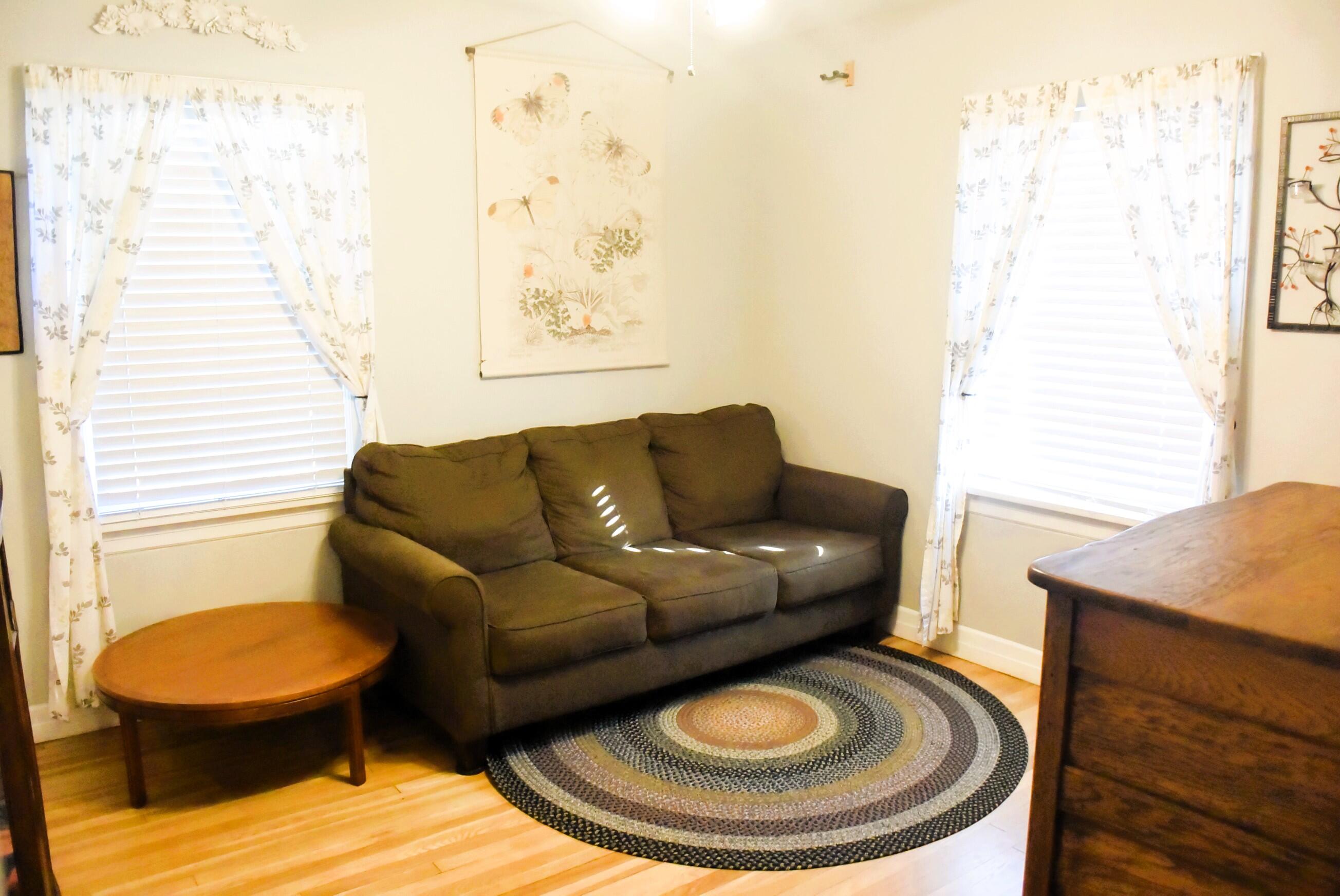 2508 24th Street Lubbock, TX 79410 - Photo 12 of 14 a living room with furniture a rug and a window