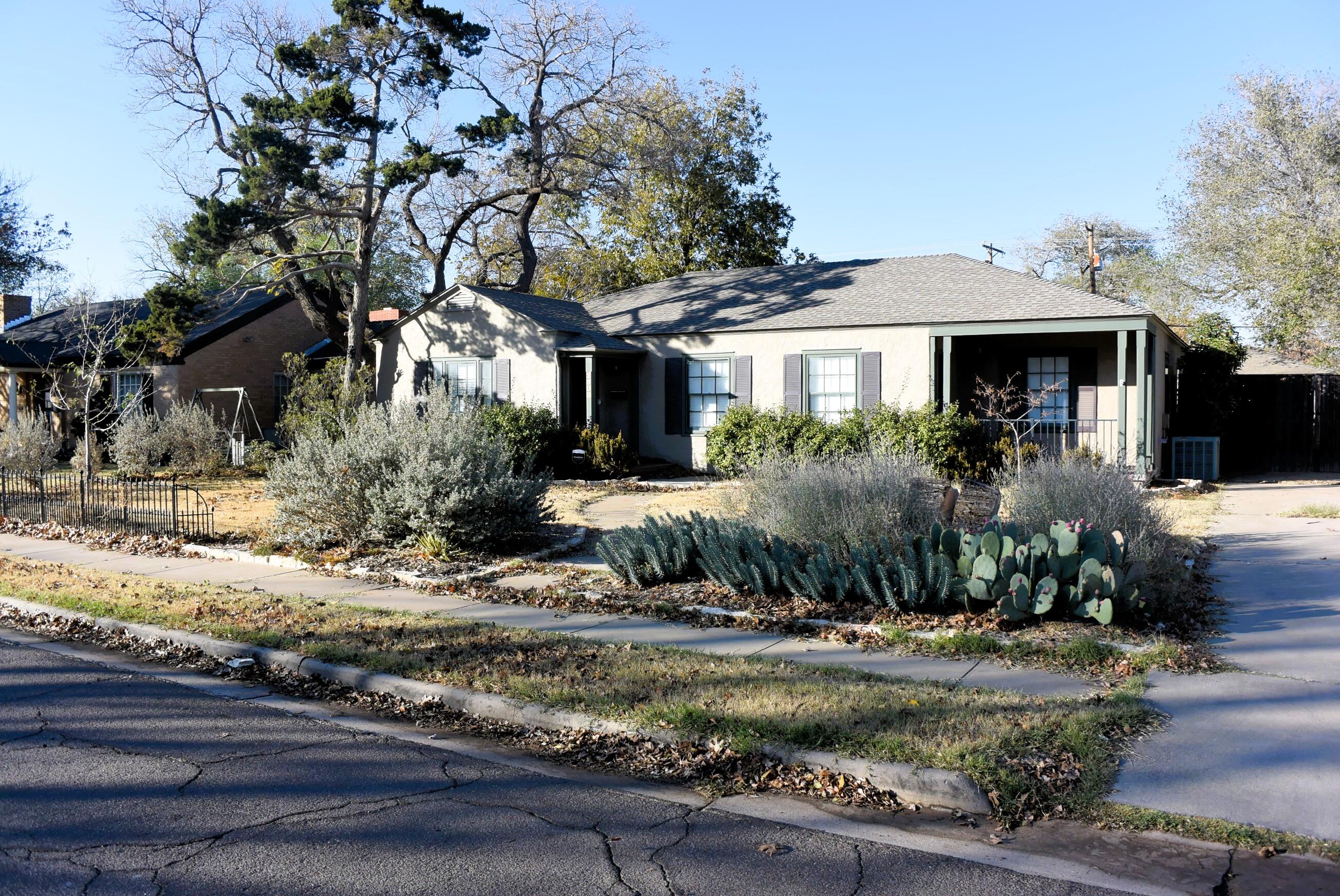 2508 24th Street Lubbock, TX 79410 - Photo 2 of 14 a front view of a house with garden
