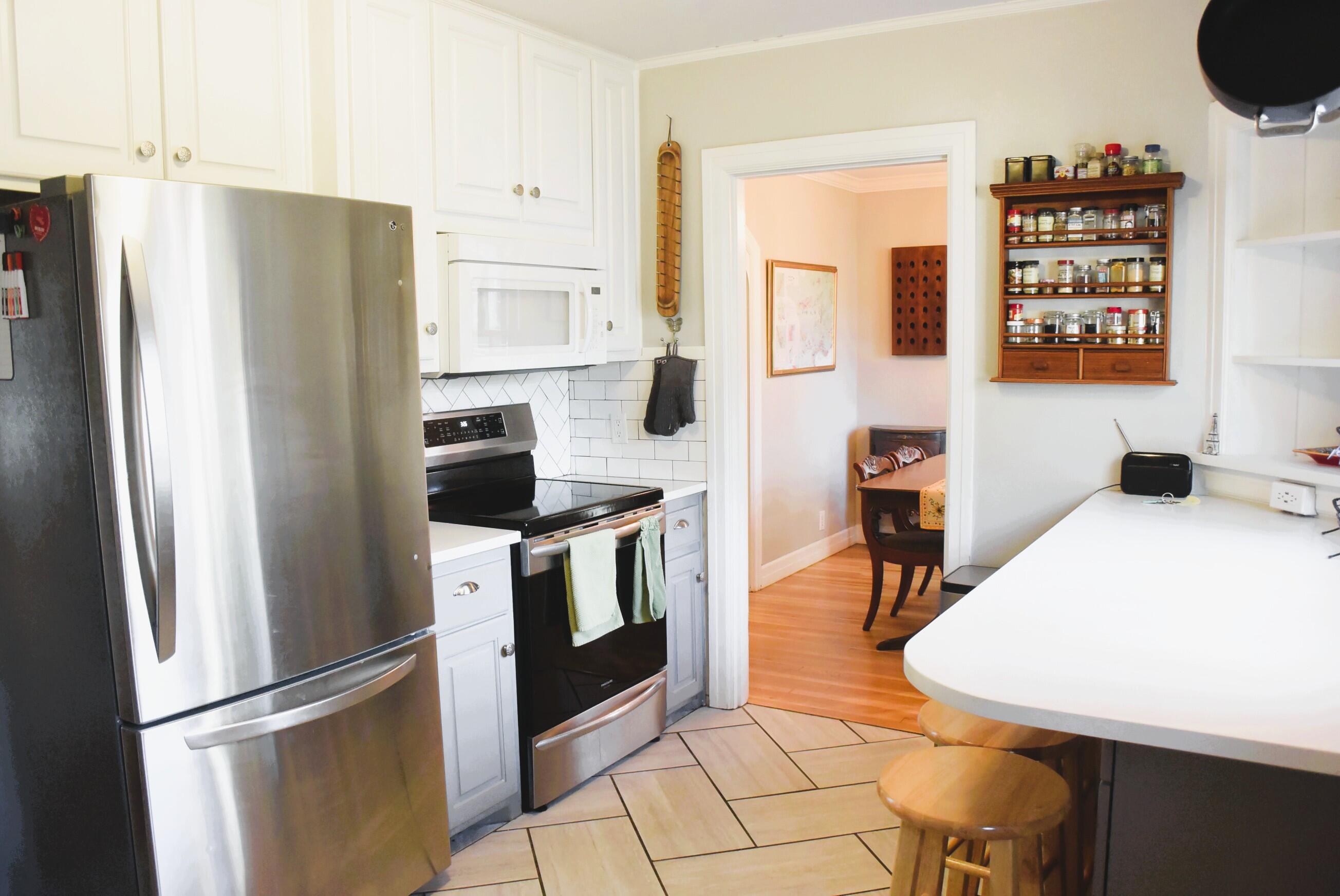 2508 24th Street Lubbock, TX 79410 - Photo 6 of 14 a kitchen with stainless steel appliances a refrigerator and a stove top oven