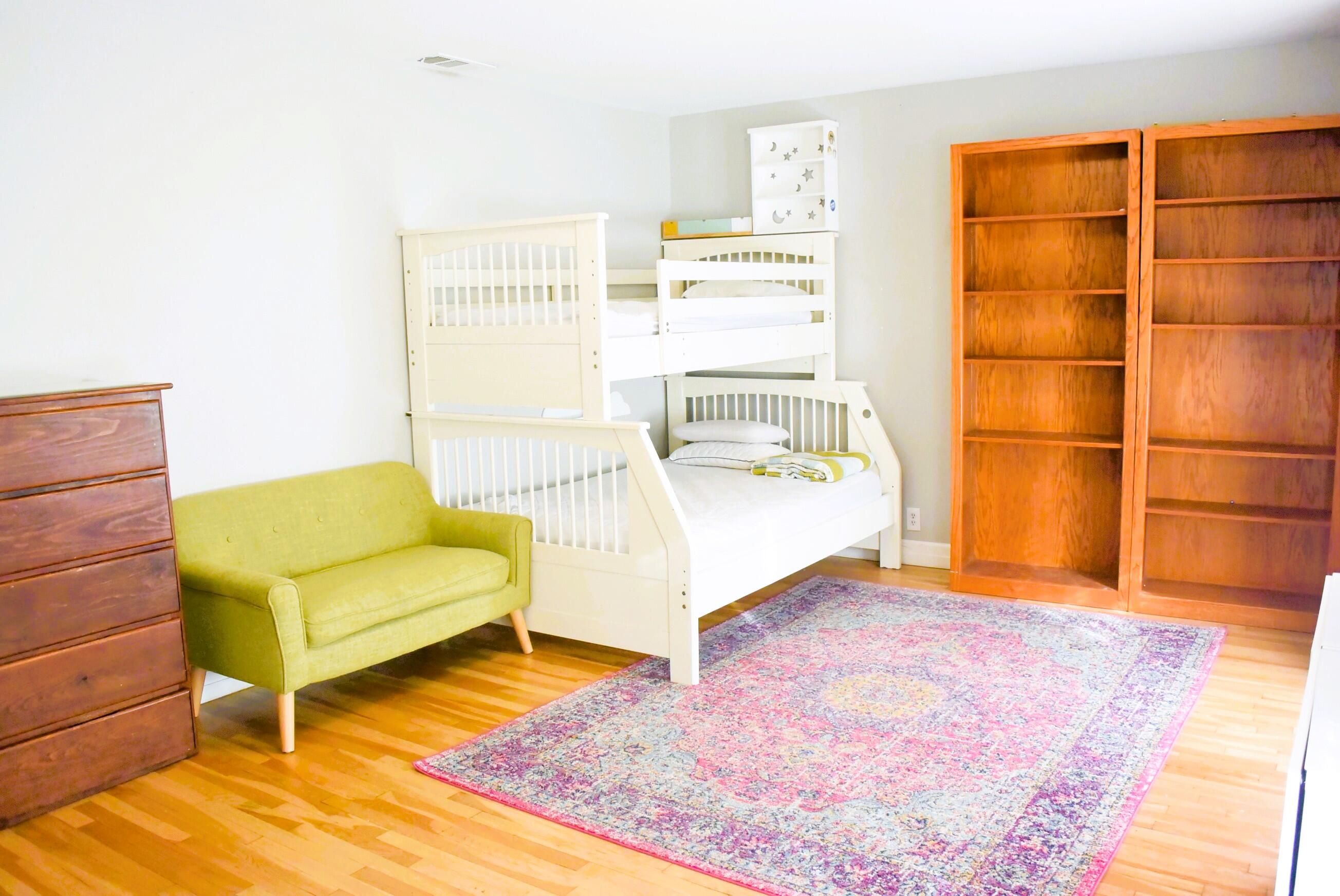 2508 24th Street Lubbock, TX 79410 - Photo 10 of 14 a living room with a couch and a rug