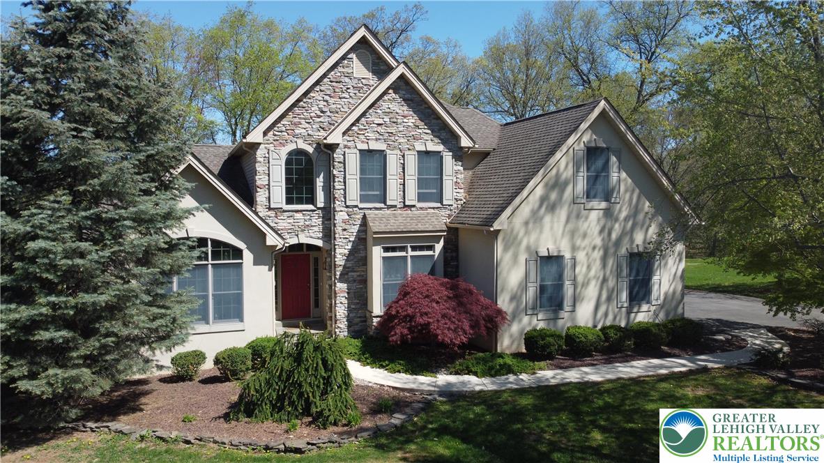 415 Colver Road Nazareth, PA 18064 - Photo 1 of 41 a front view of a house with a garden