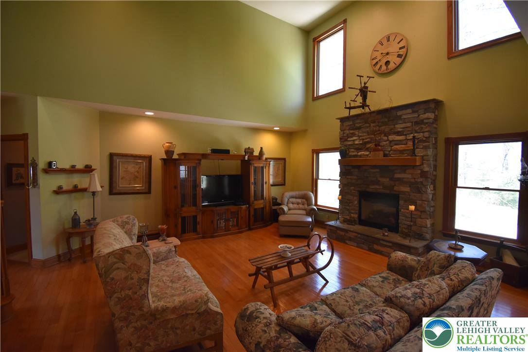 415 Colver Road Nazareth, PA 18064 - Photo 23 of 41 a living room with furniture and a fireplace
