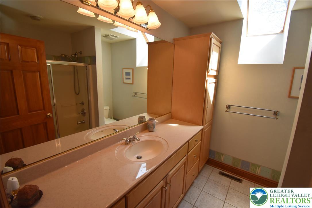 415 Colver Road Nazareth, PA 18064 - Photo 28 of 41 a bathroom with a sink a mirror and a shower