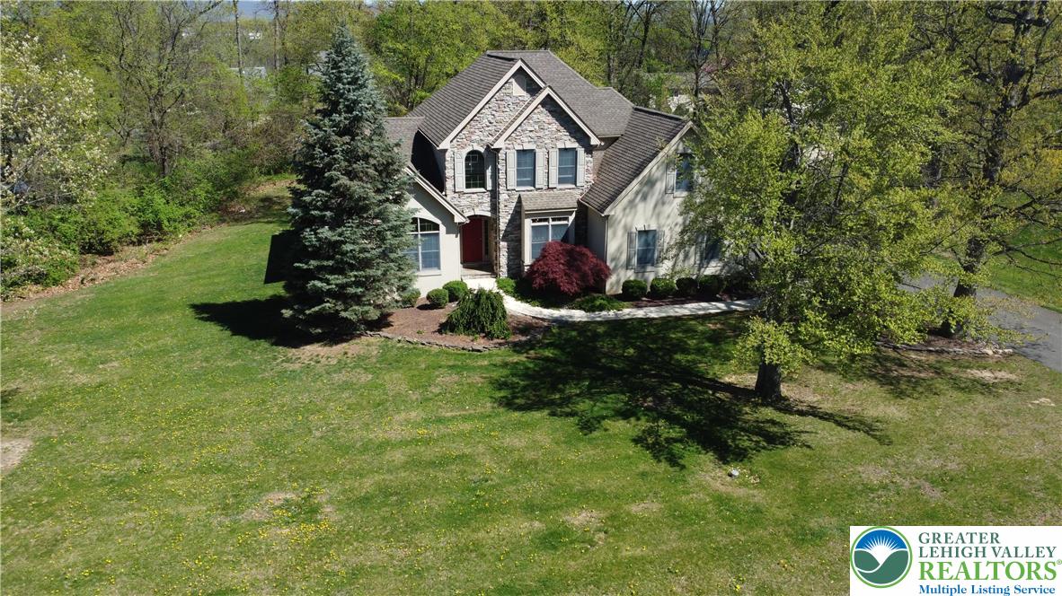 415 Colver Road Nazareth, PA 18064 - Photo 3 of 41 a front view of a house with a yard and garage