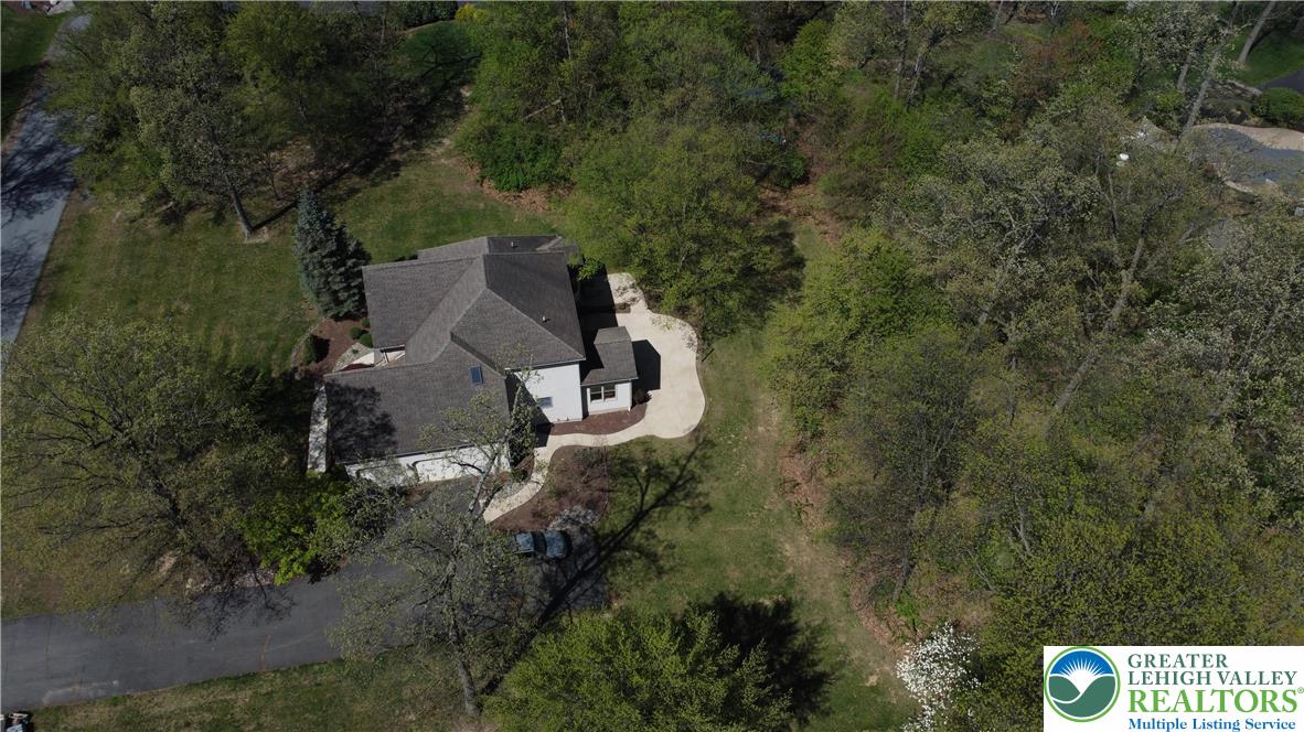 415 Colver Road Nazareth, PA 18064 - Photo 36 of 41 an aerial view of a house with outdoor space and trees all around