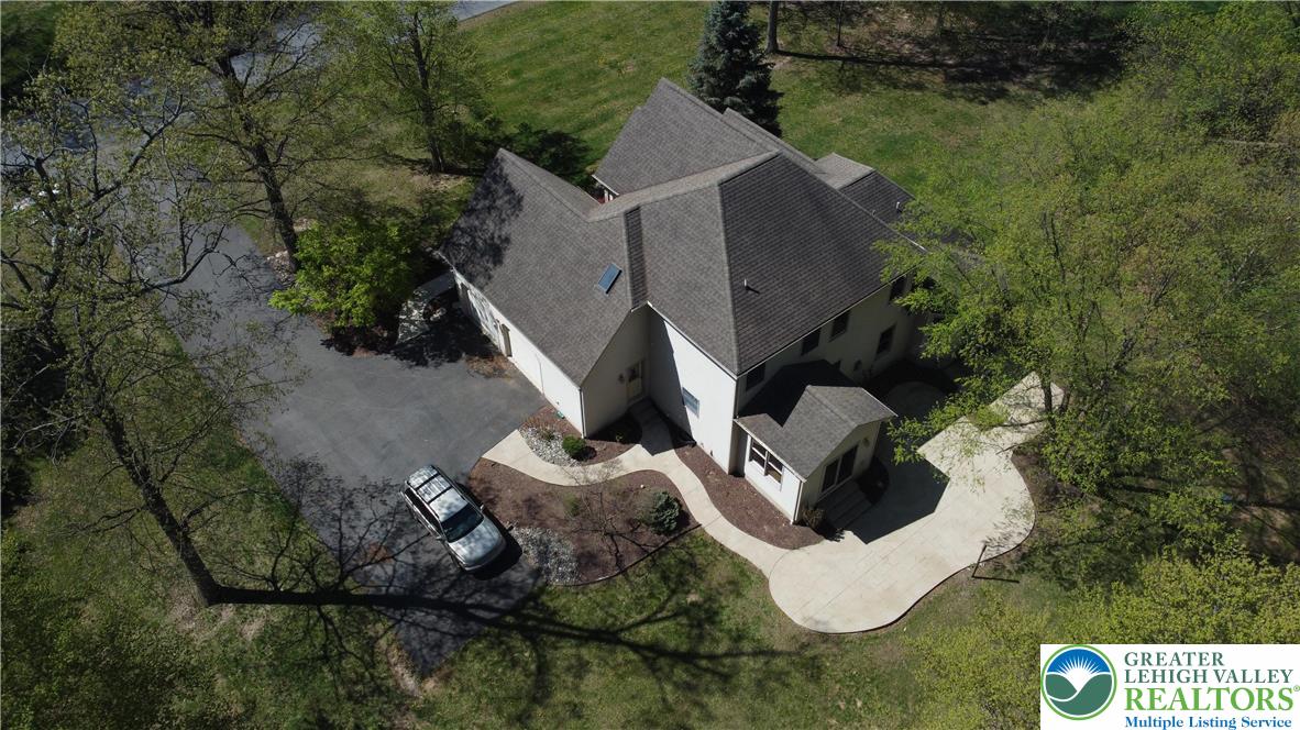 415 Colver Road Nazareth, PA 18064 - Photo 38 of 41 an aerial view of a house with a yard and sitting area