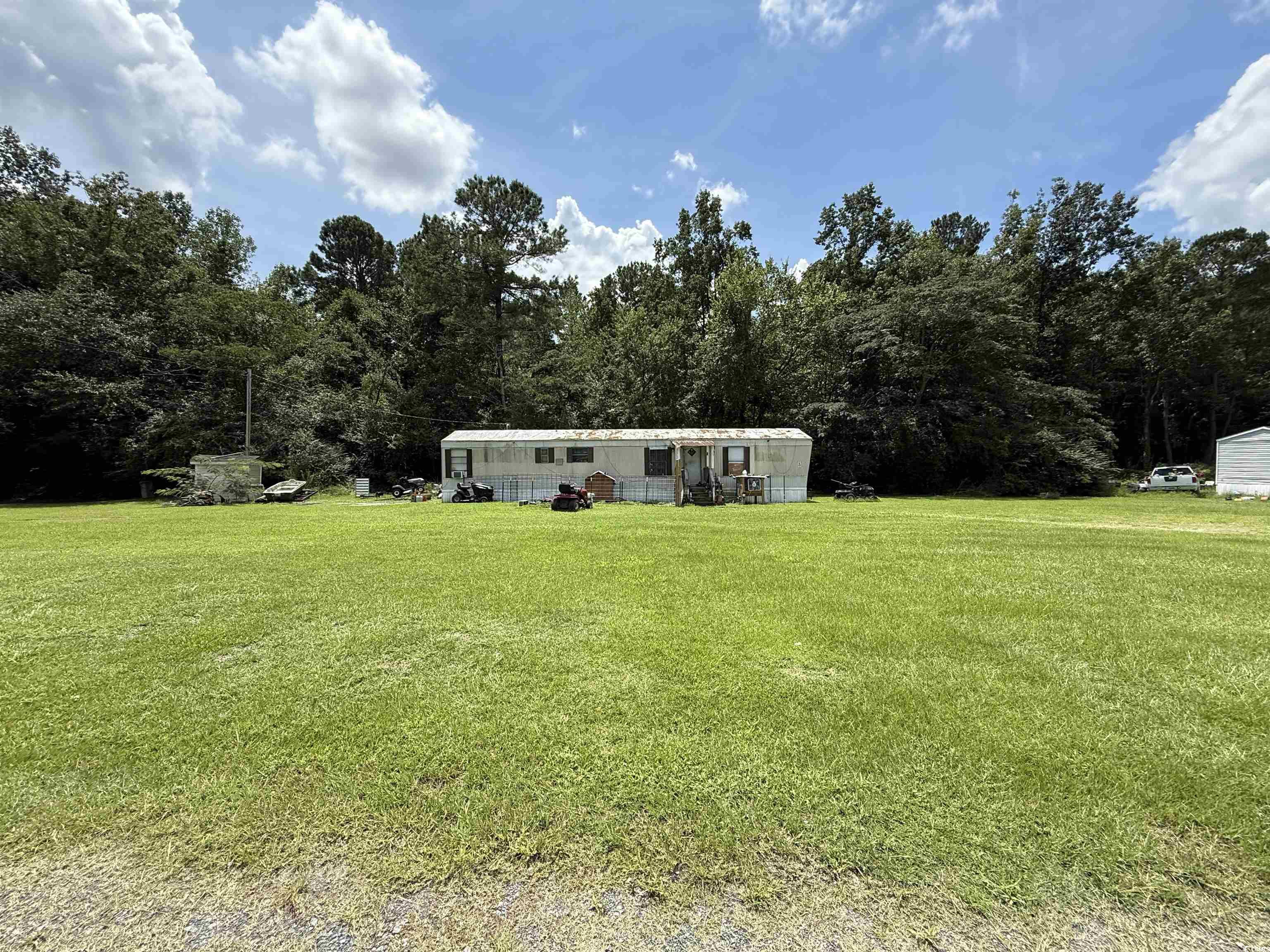 Tbd Morrisville Road Andrews, SC 29510 - Photo 19 of 29 View of front facade with a front yard and a forest view
