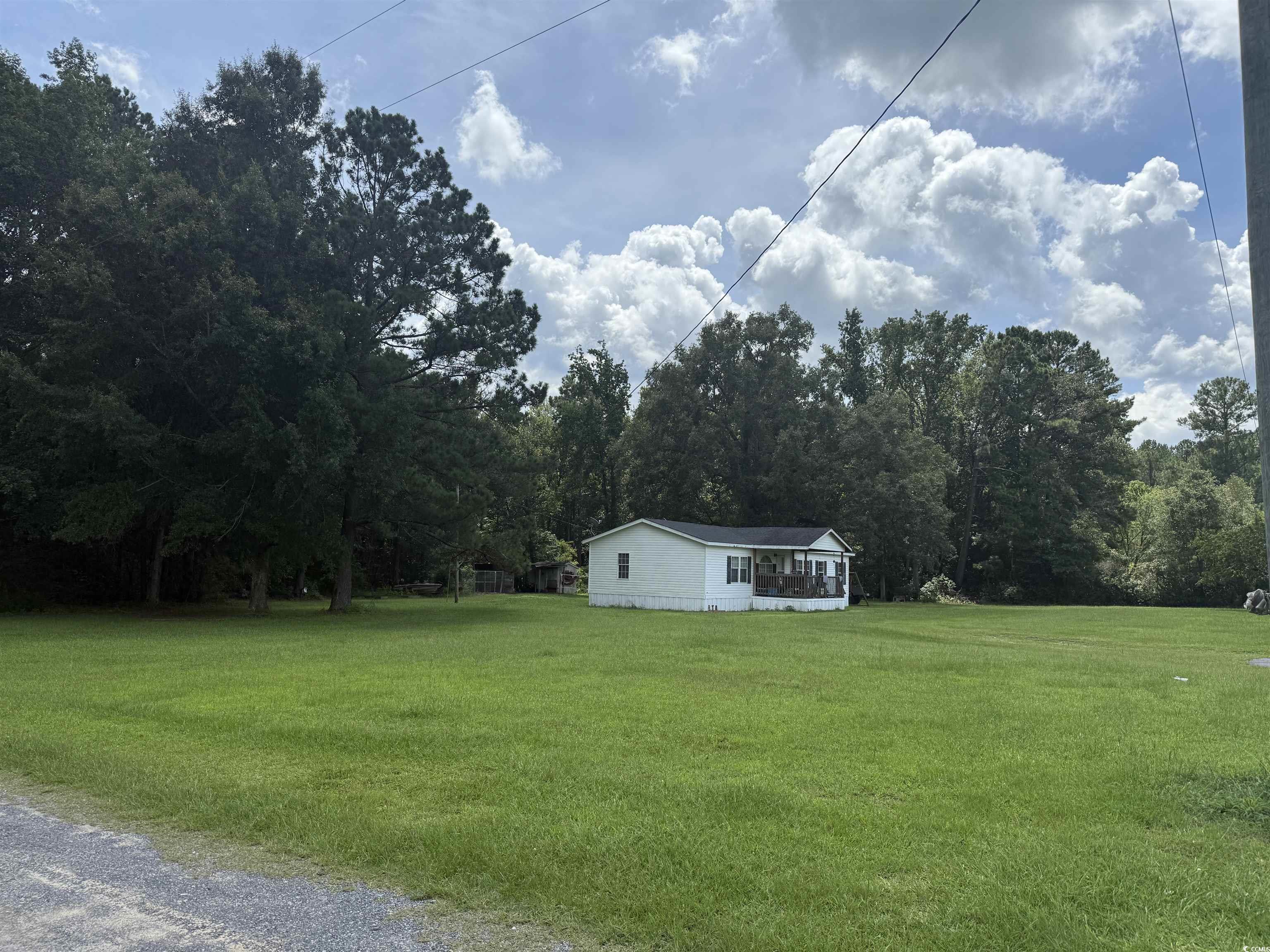 Tbd Morrisville Road Andrews, SC 29510 - Photo 2 of 29 View of green lawn featuring a view of trees and a sunroom