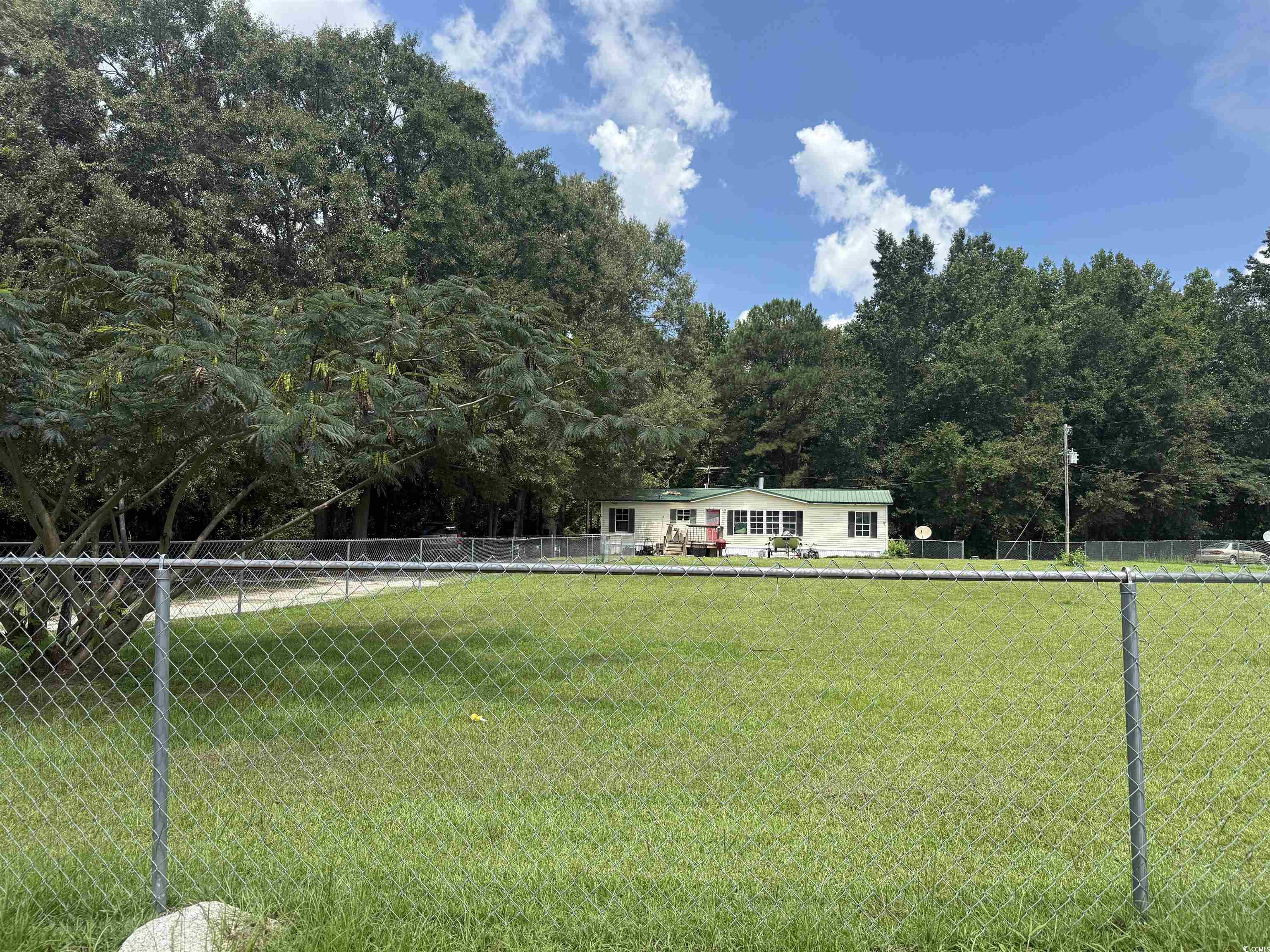 Tbd Morrisville Road Andrews, SC 29510 - Photo 10 of 29 Fenced backyard featuring a forest view