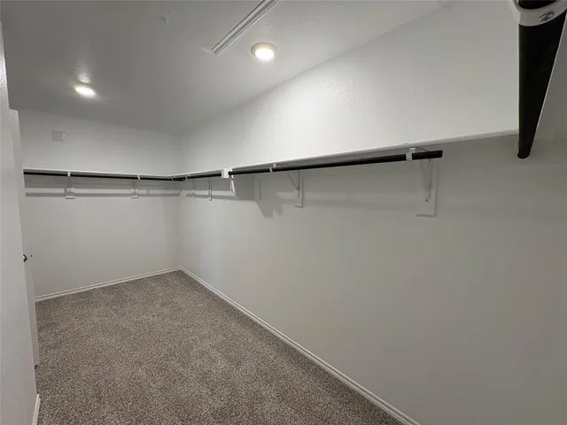 a view of a room with racks on the wall