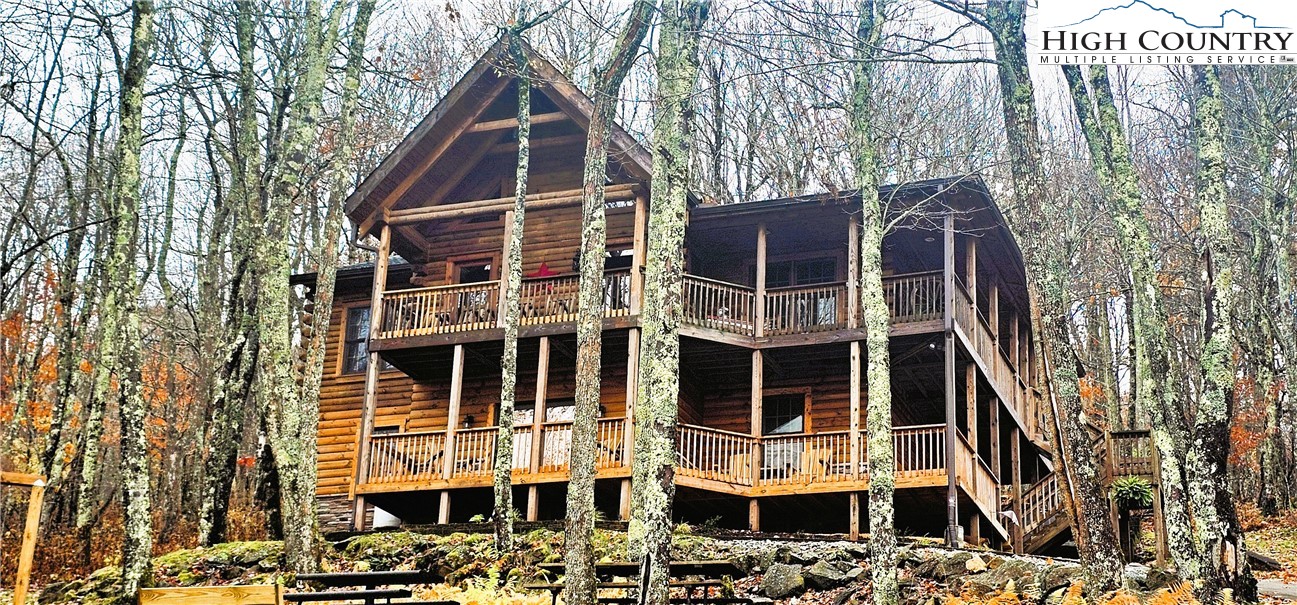 a front view of a residential apartment building with a yard