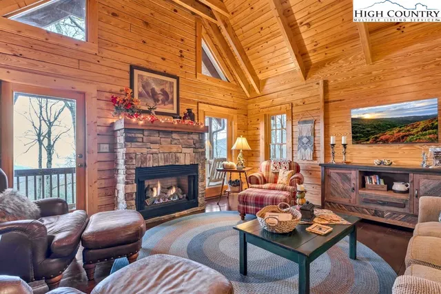 a living room with furniture fireplace and a flat screen tv