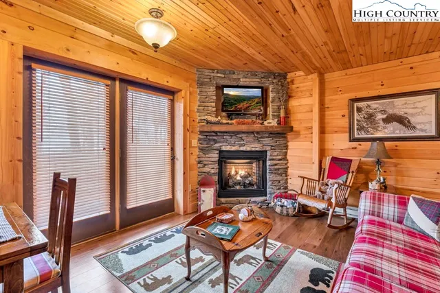 a bedroom with furniture and a fireplace