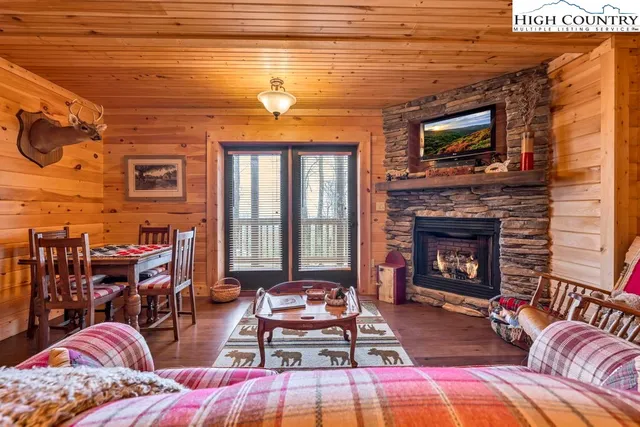 a backyard of a house with barbeque oven table and chairs