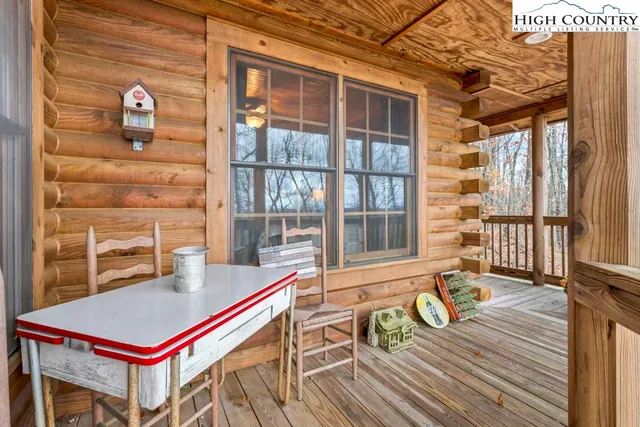 a room with pool table and windows