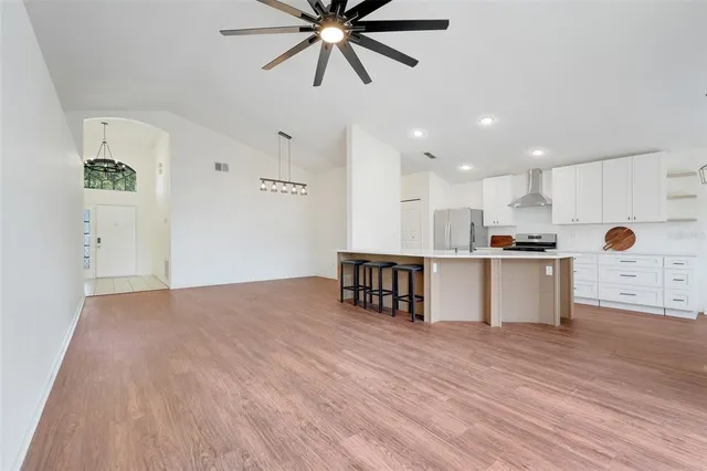 a view of kitchen with cabinets and wooden floor