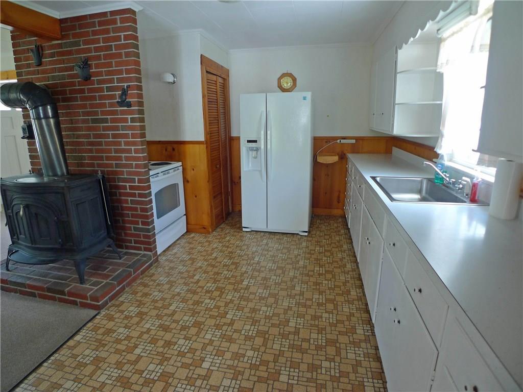 463 Wiscasset Road Boothbay, ME 04537 - Photo 7 of 19 Another view of kitchen with woodstove