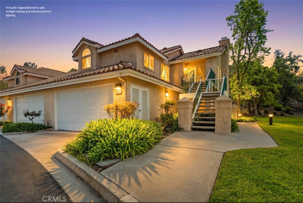 498 Shelburne Lane, Unit B Simi Valley, CA 93065 - Photo 1 of 47 a front view of a house with garden