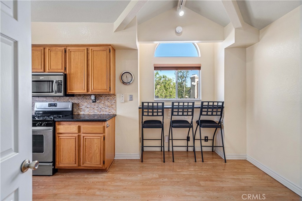 498 Shelburne Lane, Unit B Simi Valley, CA 93065 - Photo 14 of 47 a kitchen with stainless steel appliances a stove a sink and a refrigerator