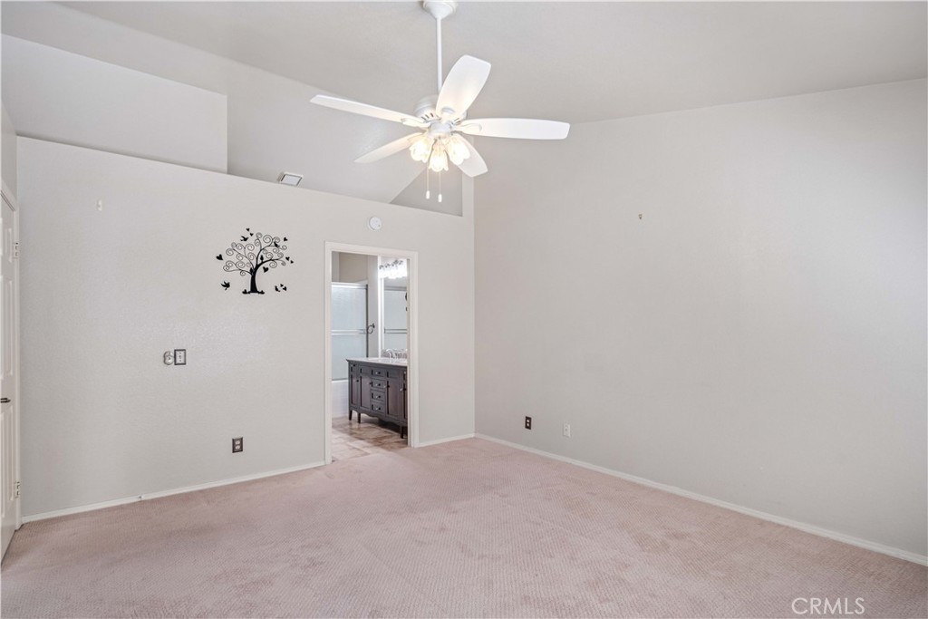 498 Shelburne Lane, Unit B Simi Valley, CA 93065 - Photo 22 of 47 an empty room with a fan & a window