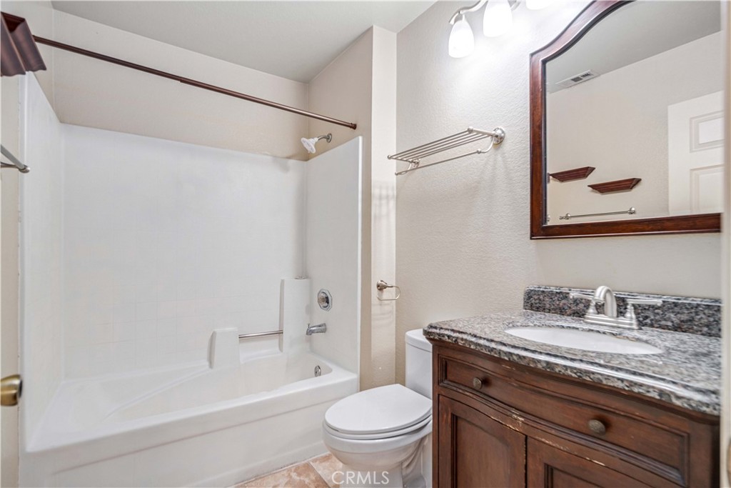 498 Shelburne Lane, Unit B Simi Valley, CA 93065 - Photo 27 of 47 a bathroom with a granite countertop sink toilet and shower