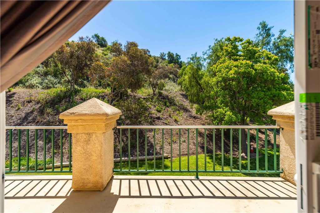 498 Shelburne Lane, Unit B Simi Valley, CA 93065 - Photo 28 of 47 a view of a wooden deck and a yard