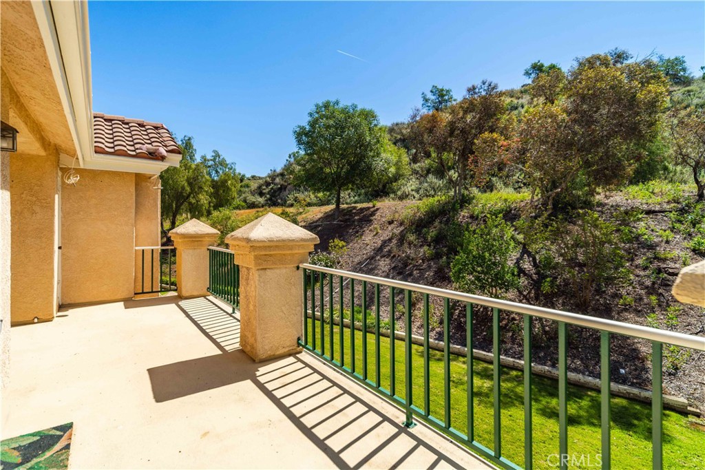 498 Shelburne Lane, Unit B Simi Valley, CA 93065 - Photo 29 of 47 a view of a balcony with wooden floor and fence