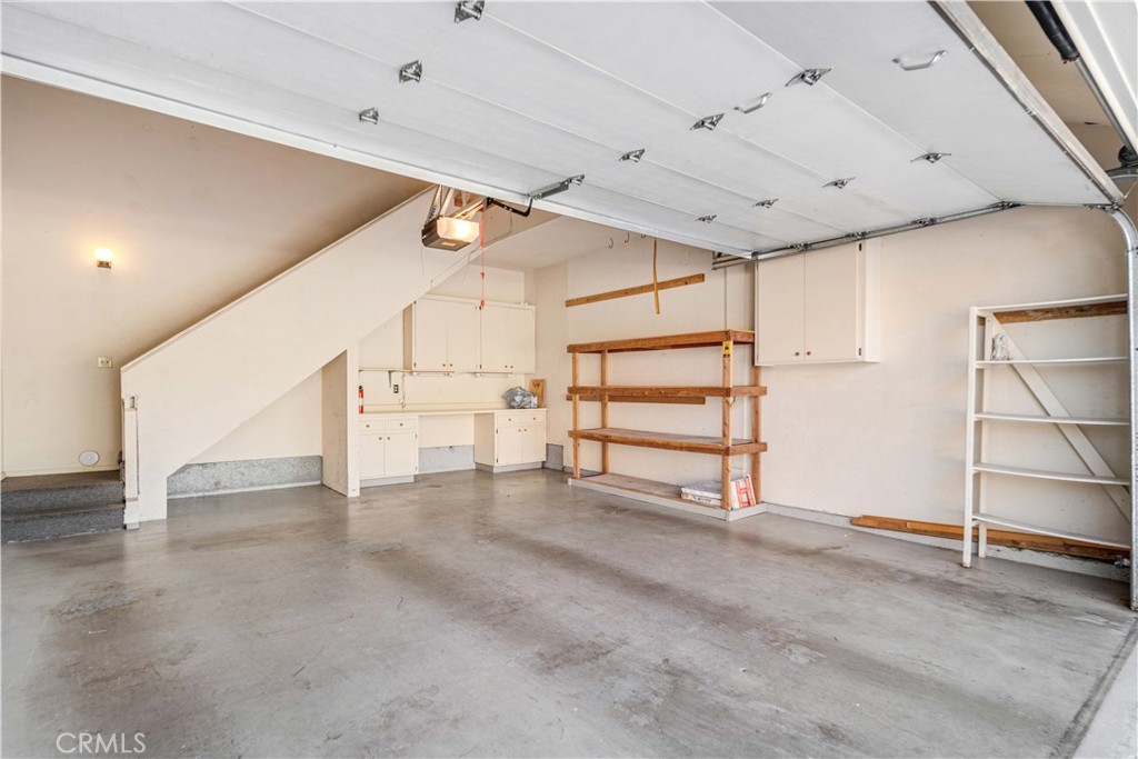 498 Shelburne Lane, Unit B Simi Valley, CA 93065 - Photo 32 of 47 a view of an empty room with stairs and chandelier